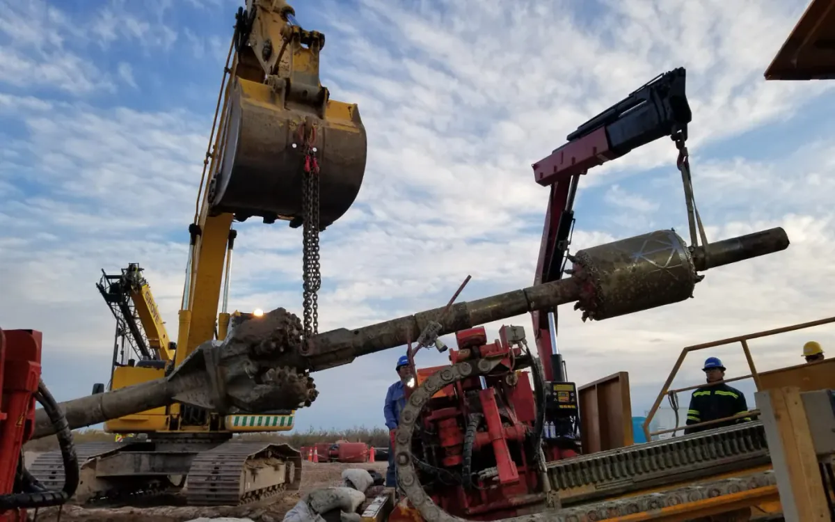 Real HDD operation with equipment, crane and field personnel
